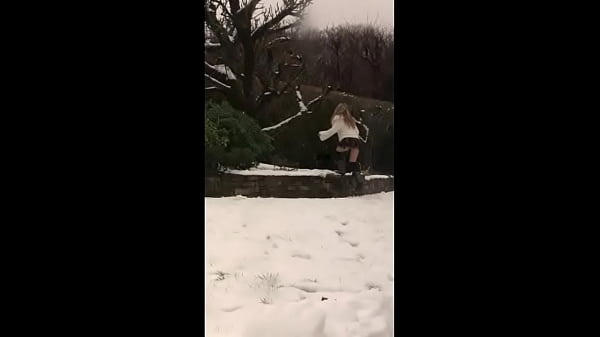Melany pissing in the snow scene